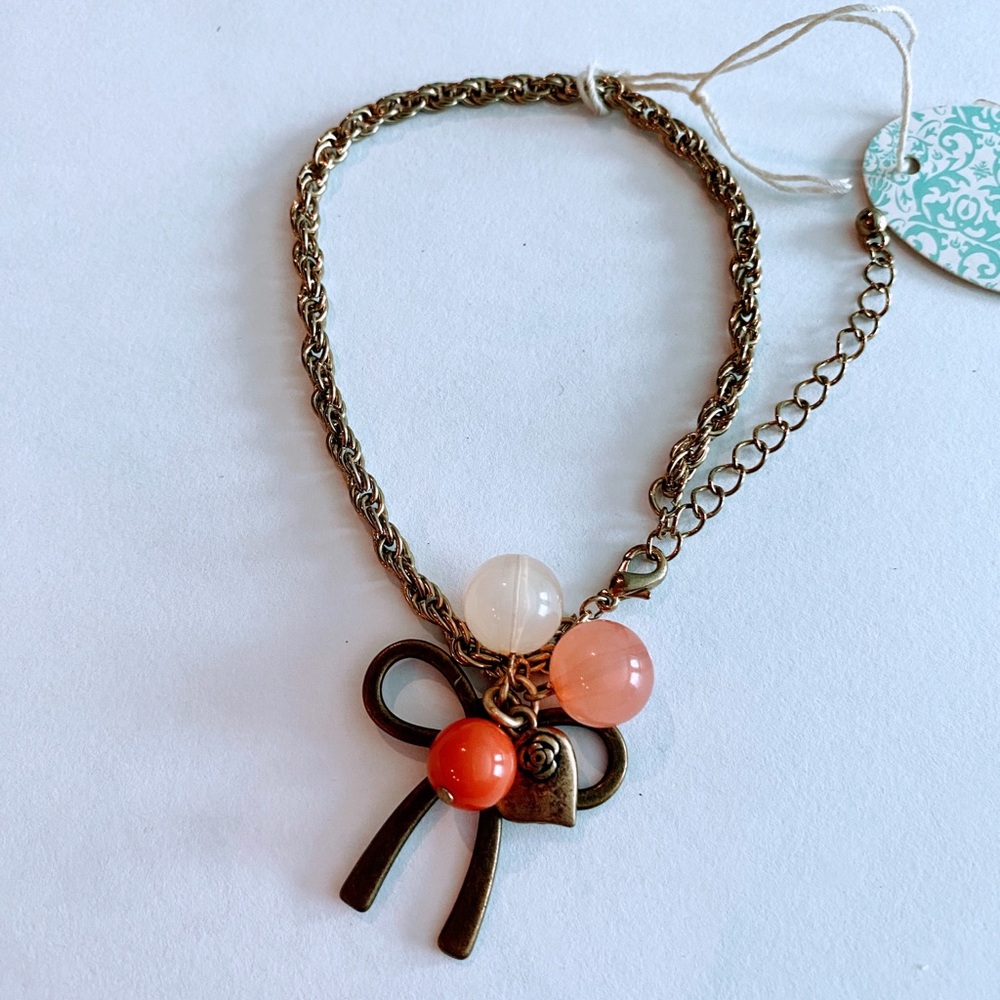Orange beaded bow bracelet